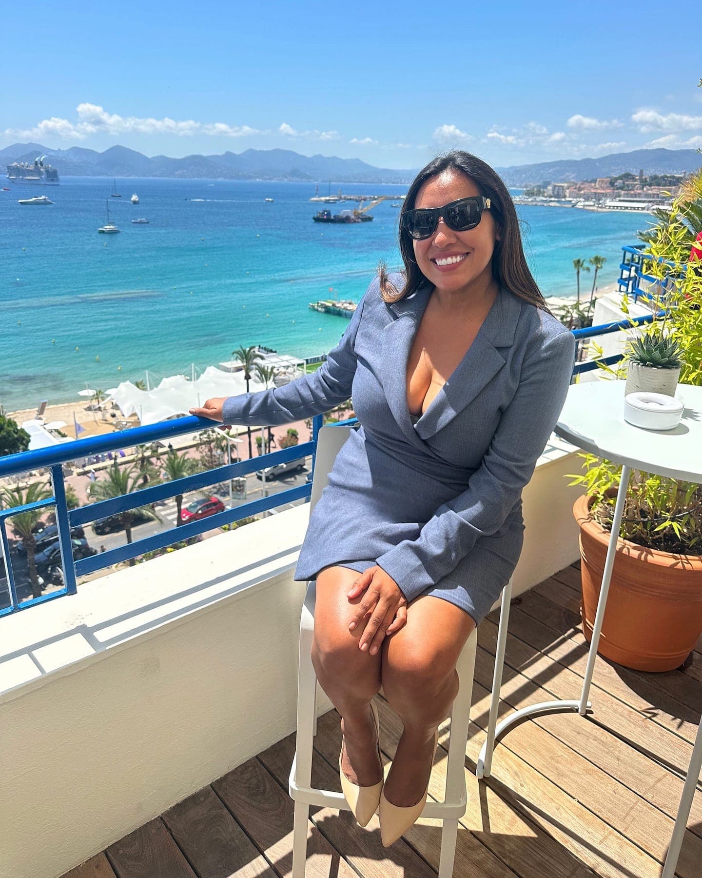 Jeannette Ceja on a seafront balcony