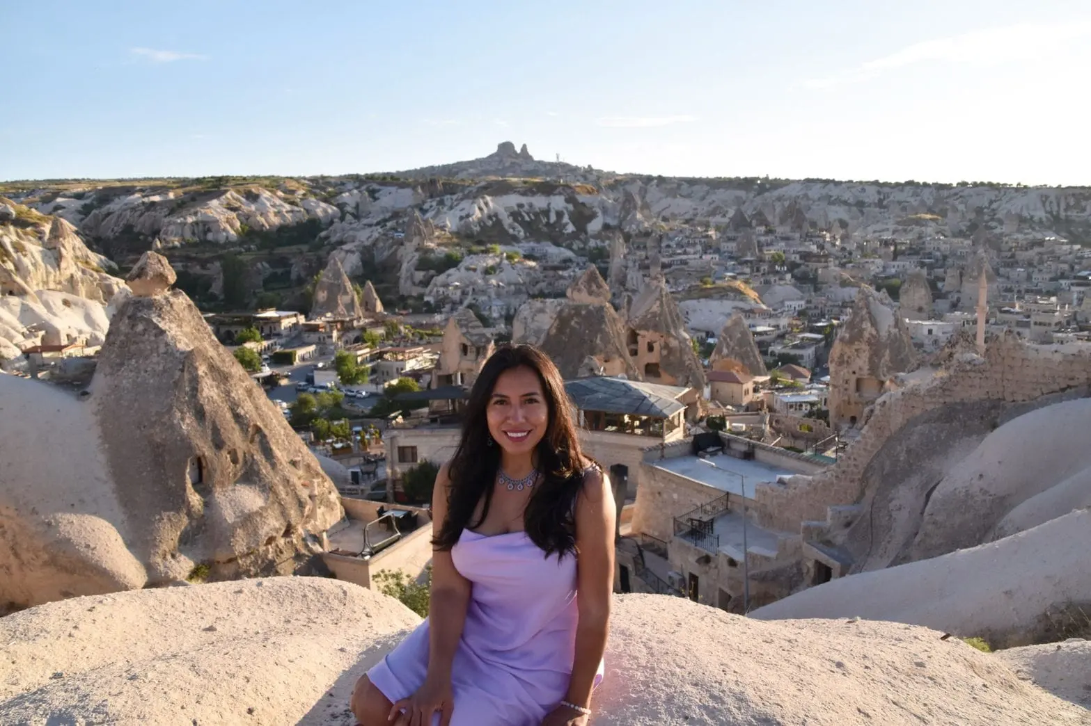 Jeannette Ceja above the rock dwellings of Cappadocia, Turkey